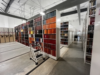 The interior of the library annex featuring rows of shelves, a step stool