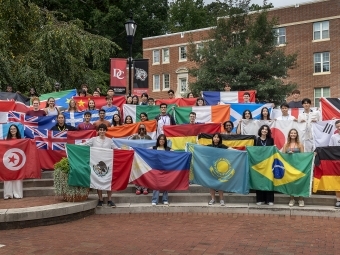 International student group class of 2029 with flags