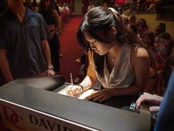 Honor Code Signing 2025 student signs her name