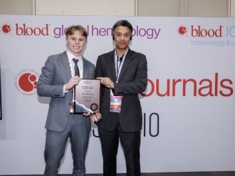 Joshua Wischmeyer, a junior biology major from Denver, Colorado, receiving award
