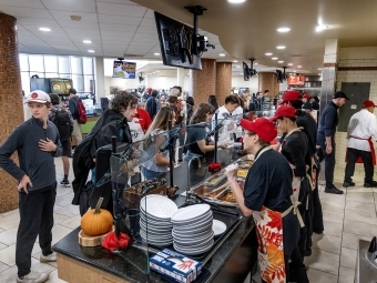 An interior shot of Commons at Commonsgiving, showing students and staff being served