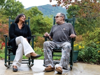 Sethi with Jake, a terminal cancer patient on a rocking chair at the Center