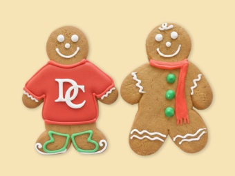 Two gingerbread people with red, white and green icing