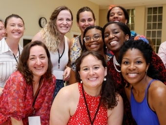 Smilng group of 8 diverse young women