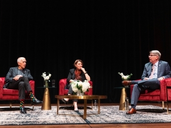 President Doug Hicks on stage with Senator Amy Klobuchar (D) of Minnesota and Senator Thom Tillis (R) of North Carolina