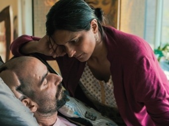 Aditi Sethi serves as a death doula to Ethan Sisser she is comforting him in his bed