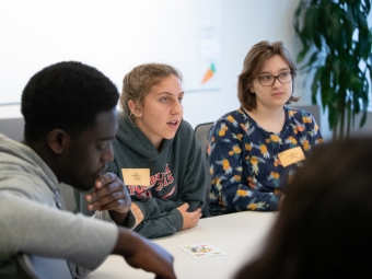 Students speaking at a conference