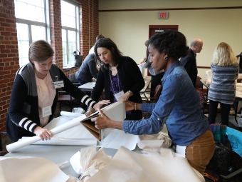 Examining historical documents on a table