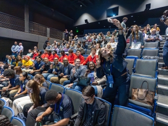Students in red take a selfie