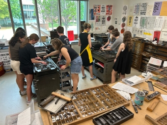 The letterpress lab full of students, with both presses in action