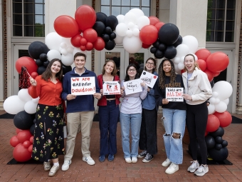 All In for Davidson 2026 Students with signs under balloons