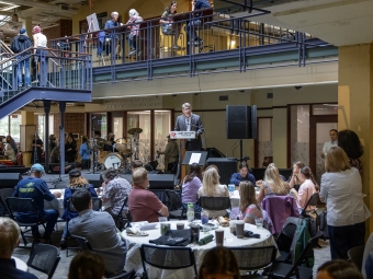 Verna Miller Case Research and Creative Works Symposium President Hicks addresses the crowd in the Alvarez student union