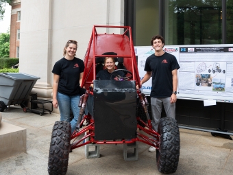 Verna Miller Case research and creative works symposium students in and around off-road vehicle