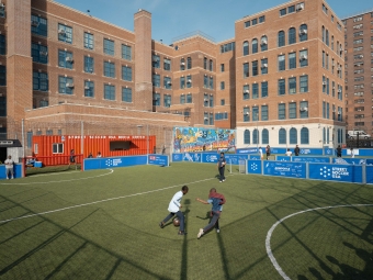 Children play soccer at the Street Soccer USA headquarters