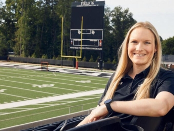 Madison See, the director of mental health for athletics at Davidson, in the stands of Davidson College Stadium. Matthew Laczko For to the Observer