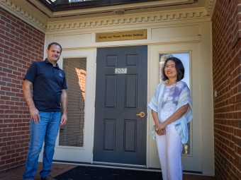 Physical Plant Staff in front of office door