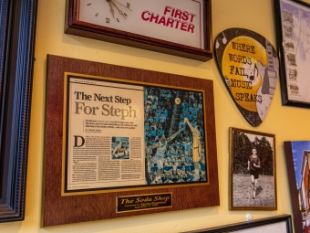 A newspaper clipping mounted on the wall about Steph Curry