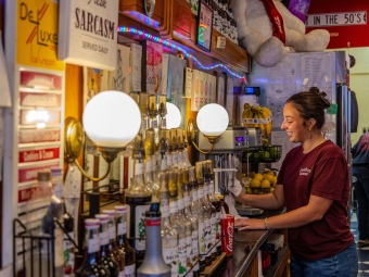 Drinks lining the wall at the soda shop