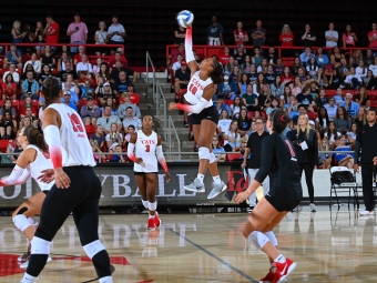 Ariyana Johnson ’29 playing volleyball jumping high for the ball