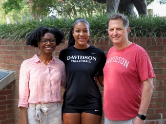 Whitney A. White ’08, Ariyana Johnson ’29, Head Volleyball Coach Chris Willis