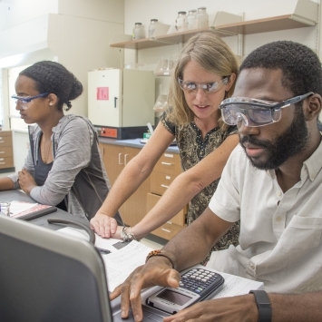 Prof. Hauser in Lab with Students