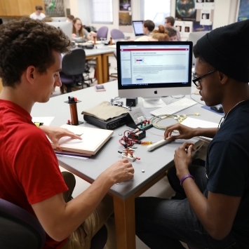 Students Performing Experiment