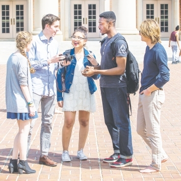 Students speaking in front of Chamber