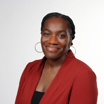 a young Black woman smiling