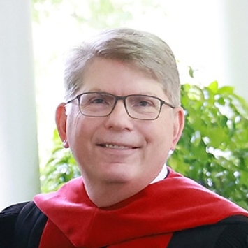 President Doug Hicks in commencement regalia