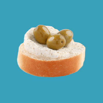 A mini open-faced sandwich with cream cheese and olives on white bread