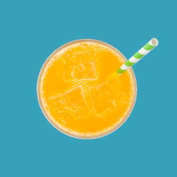 Overhead angle of an orange soda on a blue background with a green striped straw