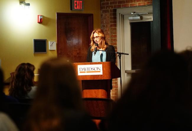 Writer Molly Sentell Haile speaking at podium