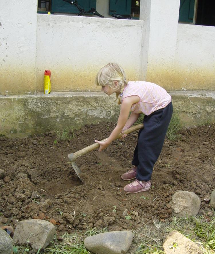 Louisa Bartkovich '22 gardening as a child