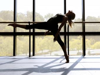 Dance Program student in front of large window